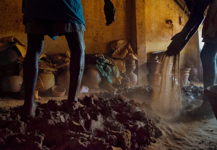 men adding sand to the clay 