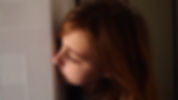 Girl looking around corner