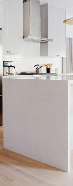 white-quartz-waterfall-island-counter.jp