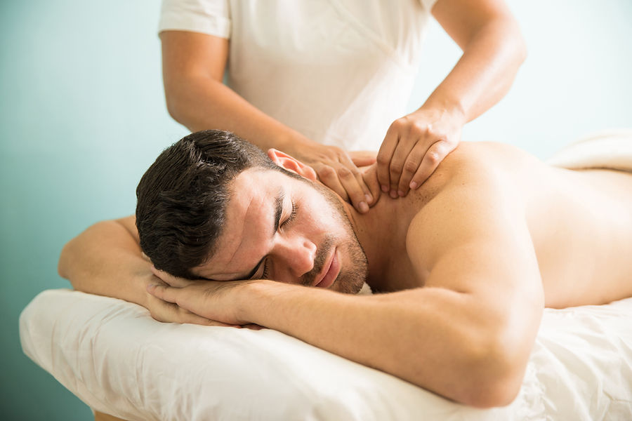 very-relaxed-young-latin-man-getting-deep-tissue-massage-his-back-wellness-spa-clinic.jpg