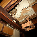 A close-up of damaged structural materia