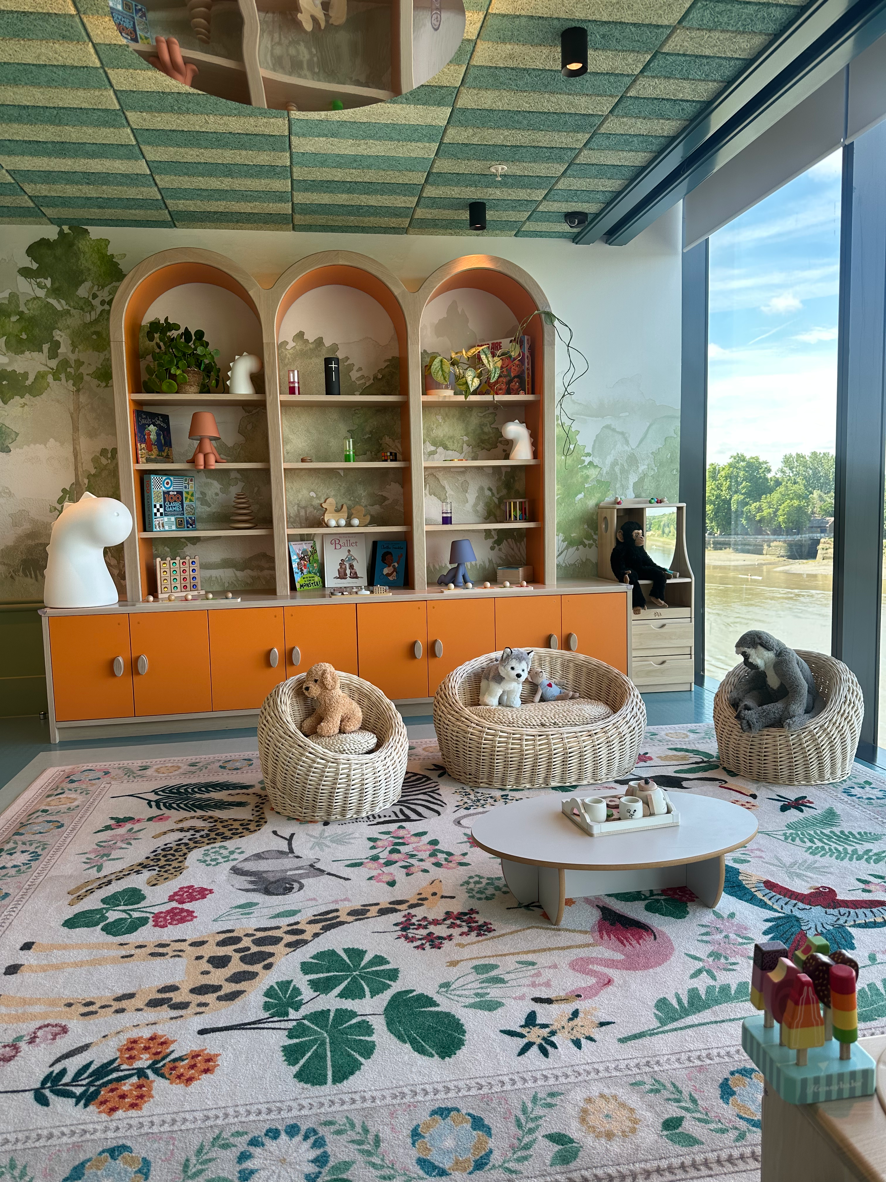 A modern and inviting children's mobile crèche setup in a luxury private club setting.