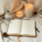 High angle view of a journal and oracle cards on a table