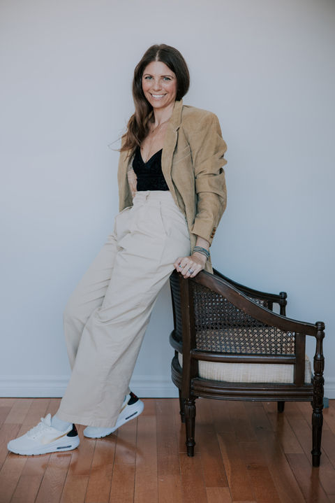 Stylish woman in neutral tones posing for modern branding headshot