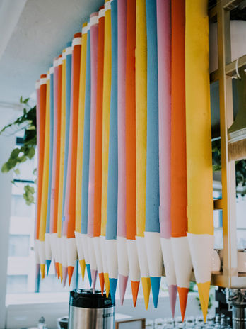 Oversized pastel pencil art installation for creative office space.