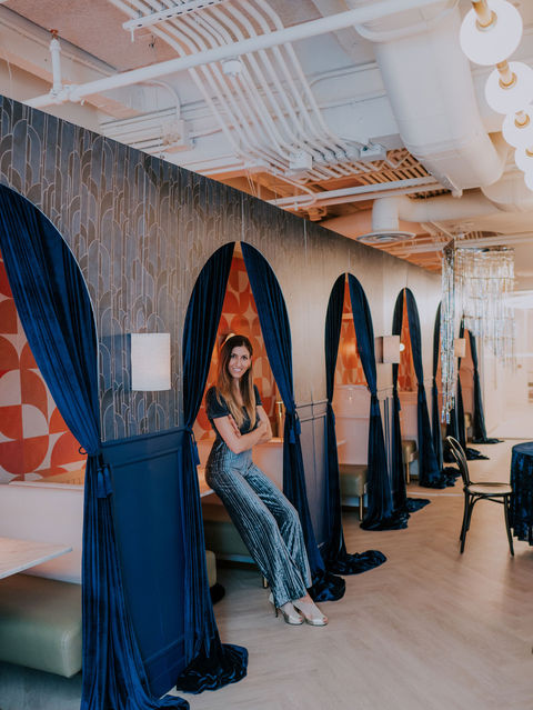 Navy blue velvet draped nooks for a private event.