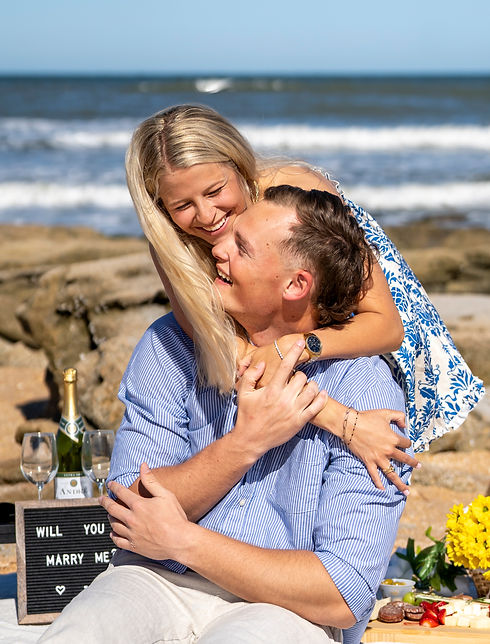 Surprise proposal photographed by a St. Augustine proposal photographer at the beach