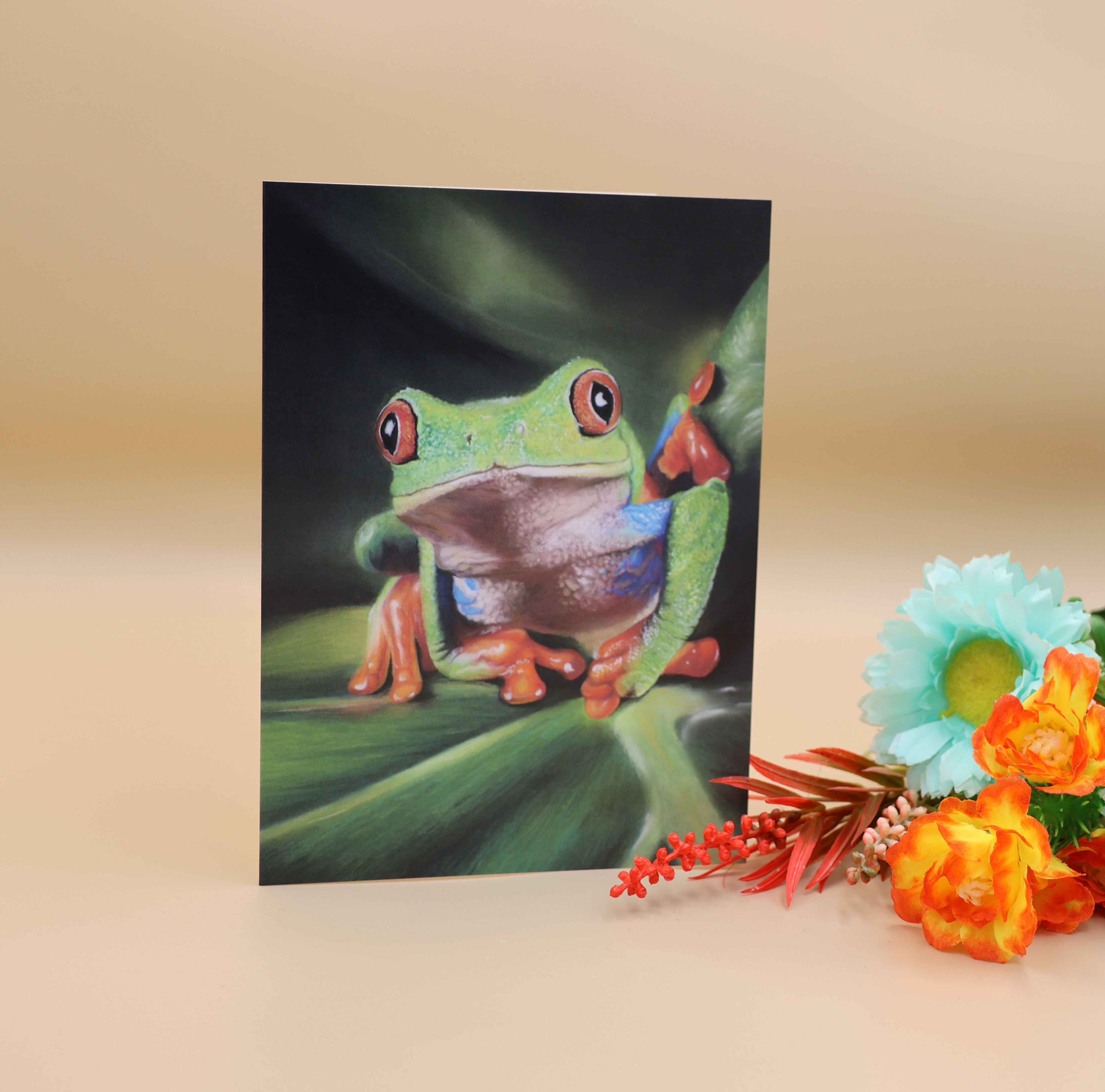 A 7 x 5 inch greetings card of a red eyed tree frog, painted by Sophie Parkhill