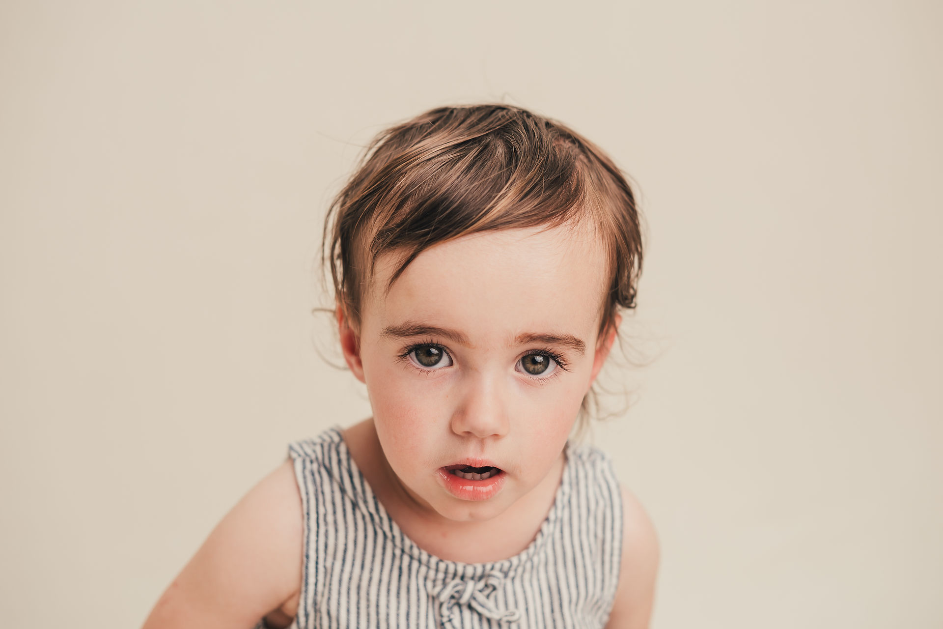 Young child with a curious expression during school picture day