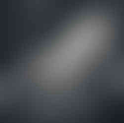 school portrait of girl in striped dress in front of chalkboard