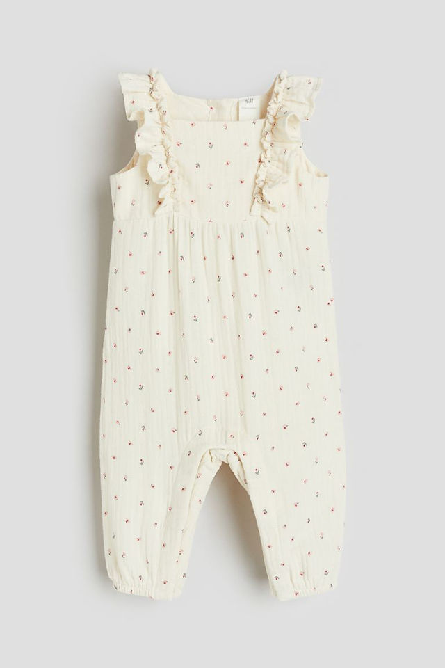 Cream floral girl's romper perfect for a spring family photo session
