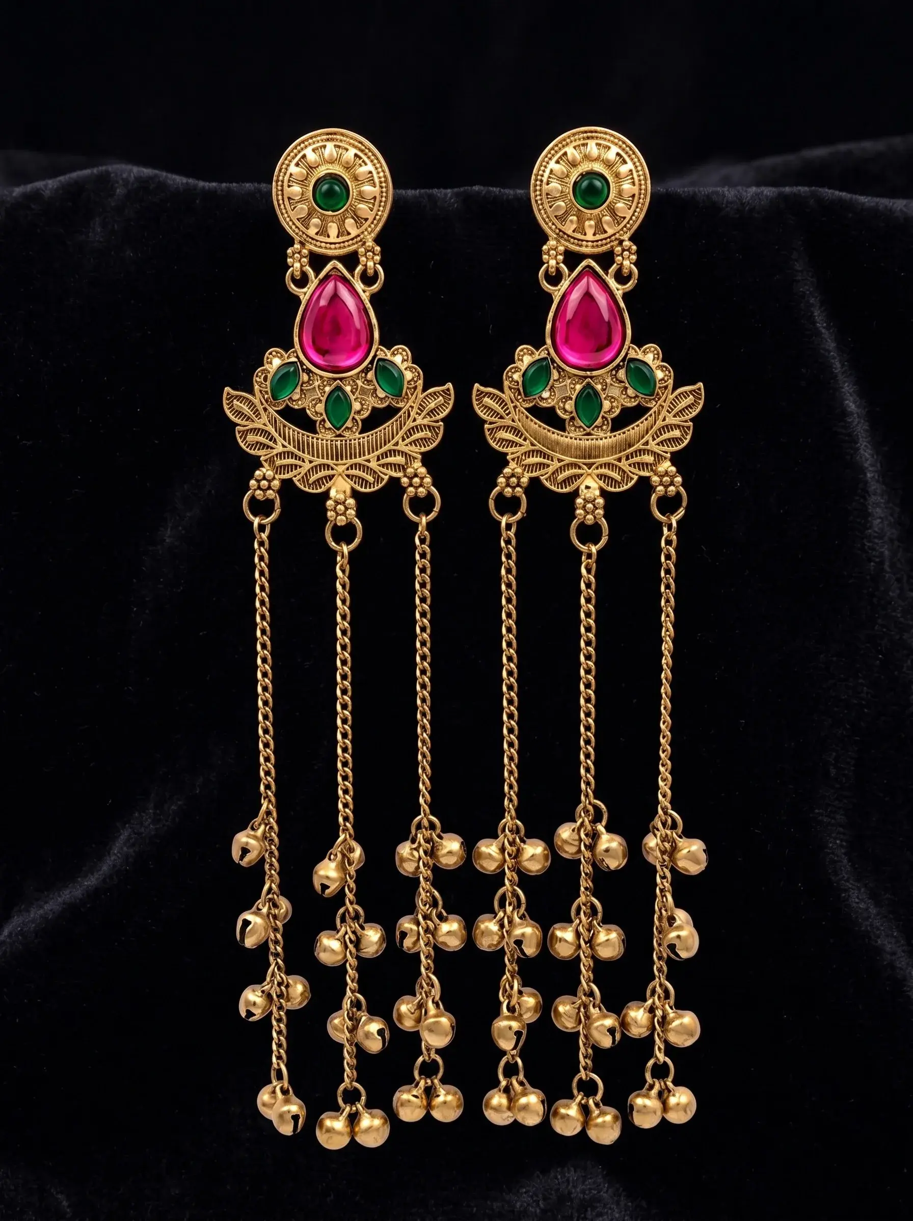 Kashmiri long brass earrings with pink and green stones, antique gold finish and ghungroo tassels.