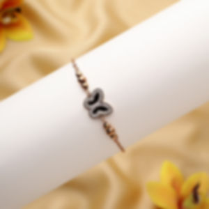 Rose gold bracelet with black butterfly centerpiece, designed for women.