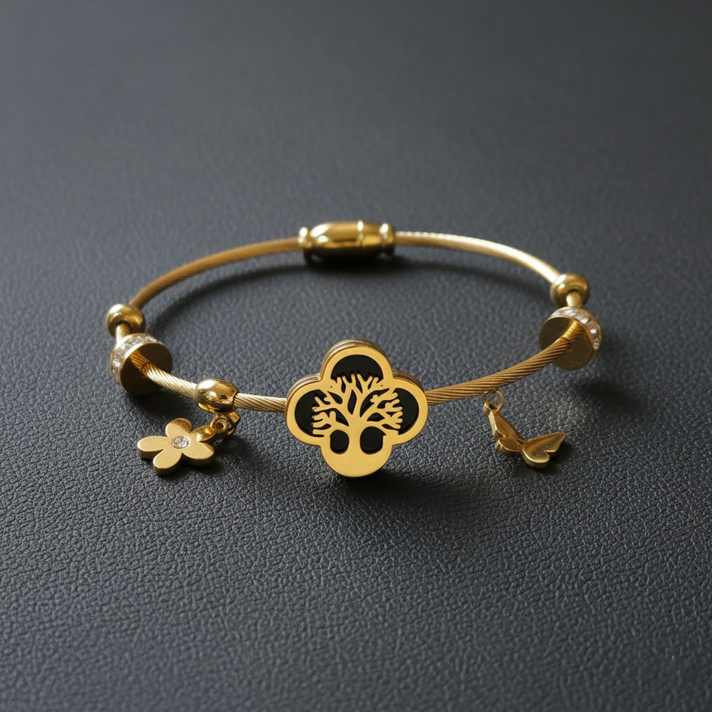 Gold-toned cable Kada bracelet for women with a central black enamel Tree of Life charm