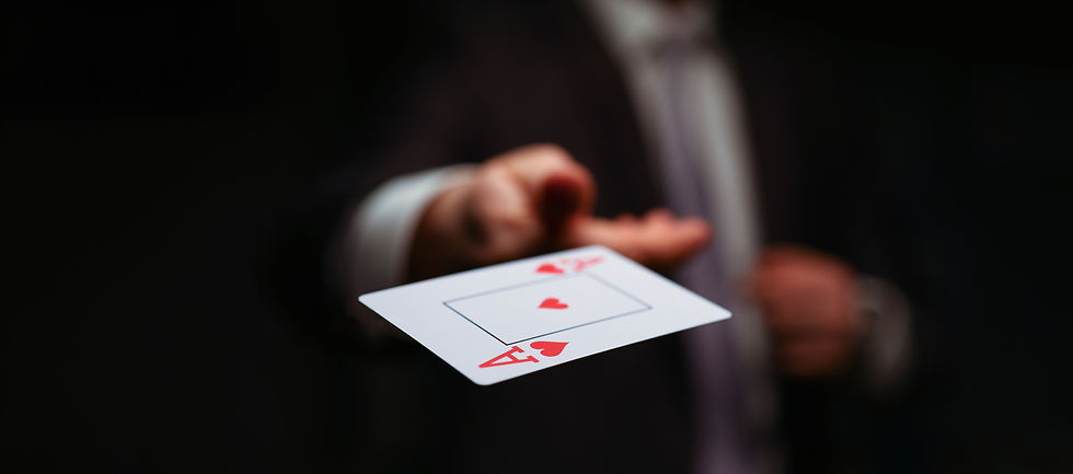 Close-up of male throwing trump out of sleeve. Professional player in presentable suit. Ad