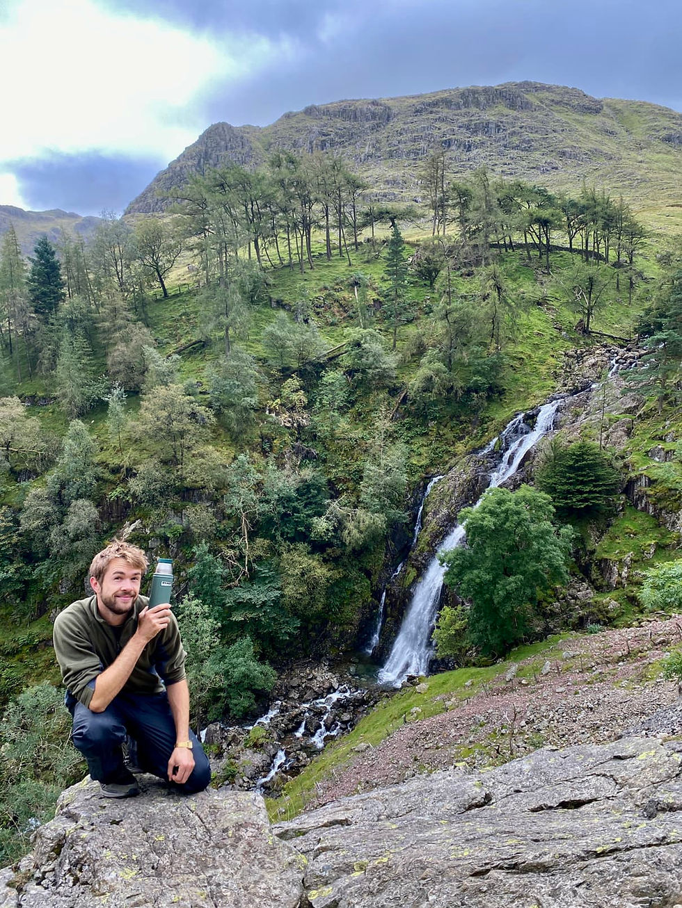 Hiking adventure at waterfall in Lake District near Scafell Pike