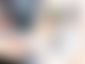 A social media manager shows a top-down view of social media management tools on her laptop.