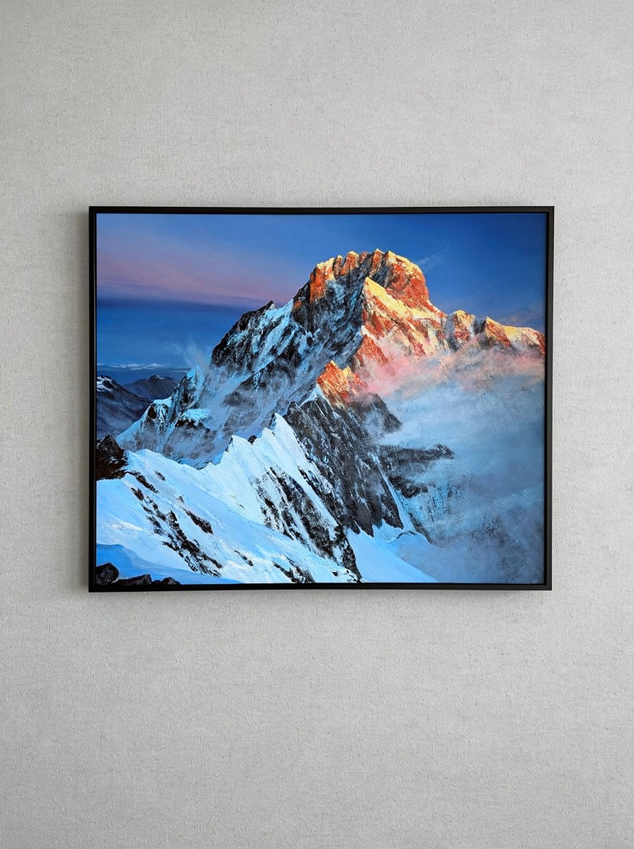 Painting of a mountain hanging on wall.