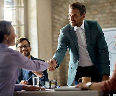 business-coworkers-shaking-hands-during-meeting-office-focus-is-businessman.jpg