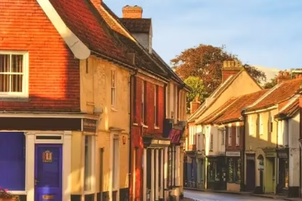 Historic street and buildings in Aylsham, Norfolk, bathed in warm autumn sunlight