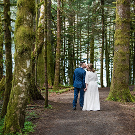A couple kissing in the rainforest during their Olympic National Park elopement