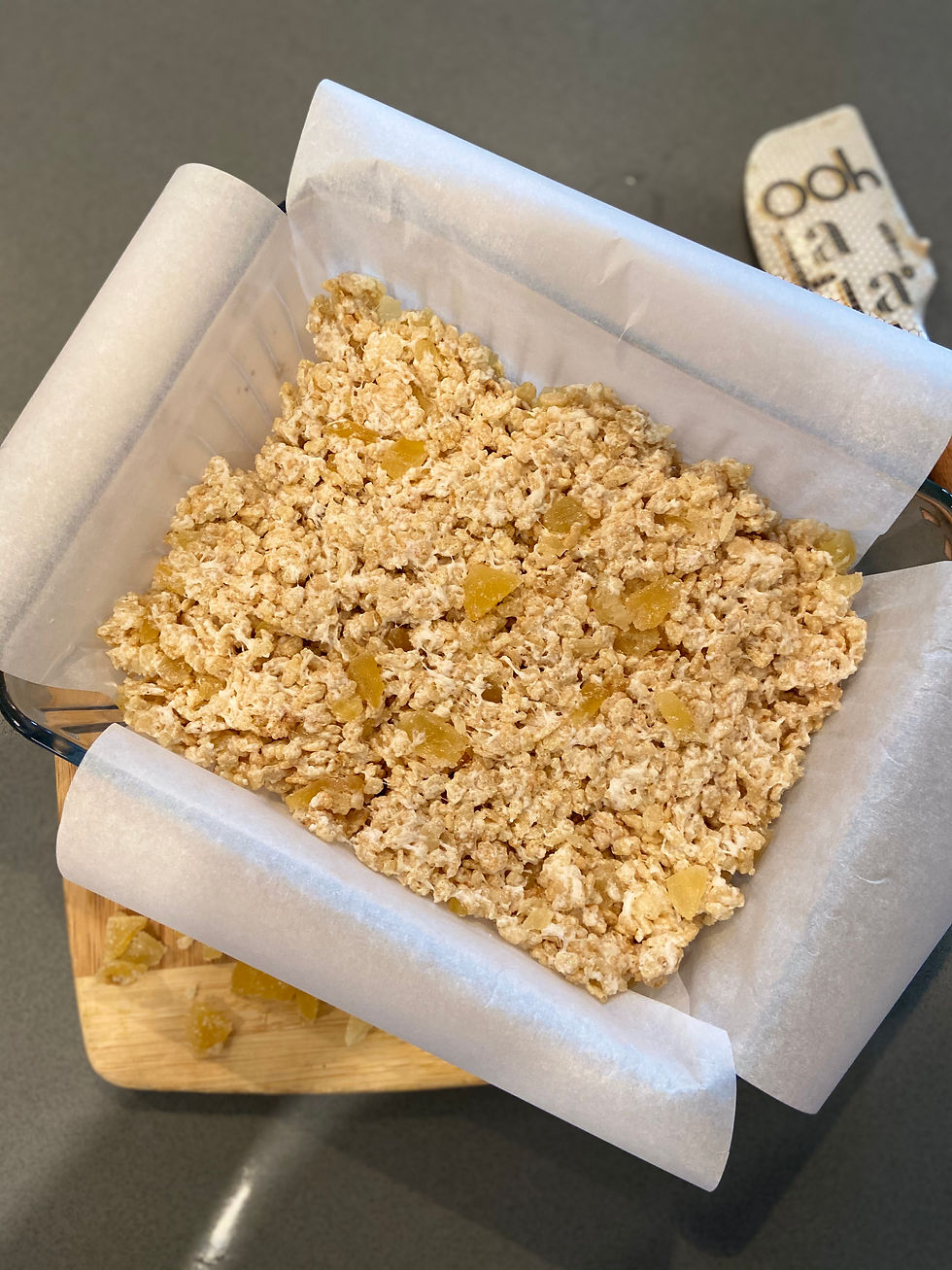 Marshmallow and rice crispy mixture spread out in the pan