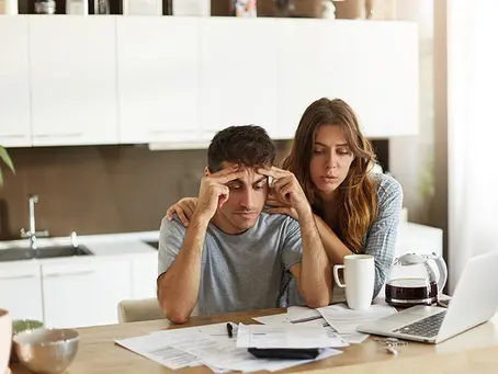 Couple looking at financing options for addiction treatment