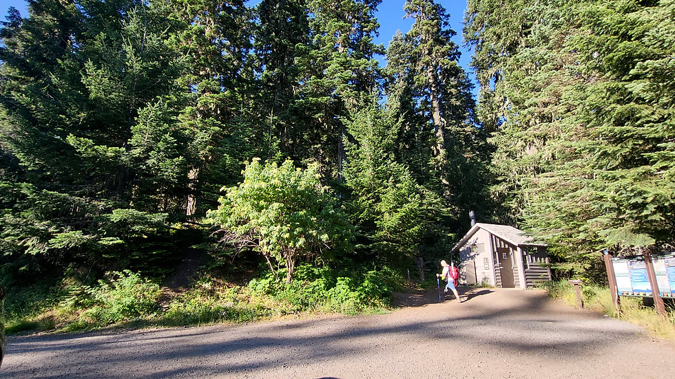 Grizzly Peak trailhead showing the toilet and parking lot.
