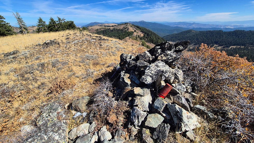 Observation Peak looking west to Mt. McLoughlin. There is a couple of cans painted red shoved together to put notes into.