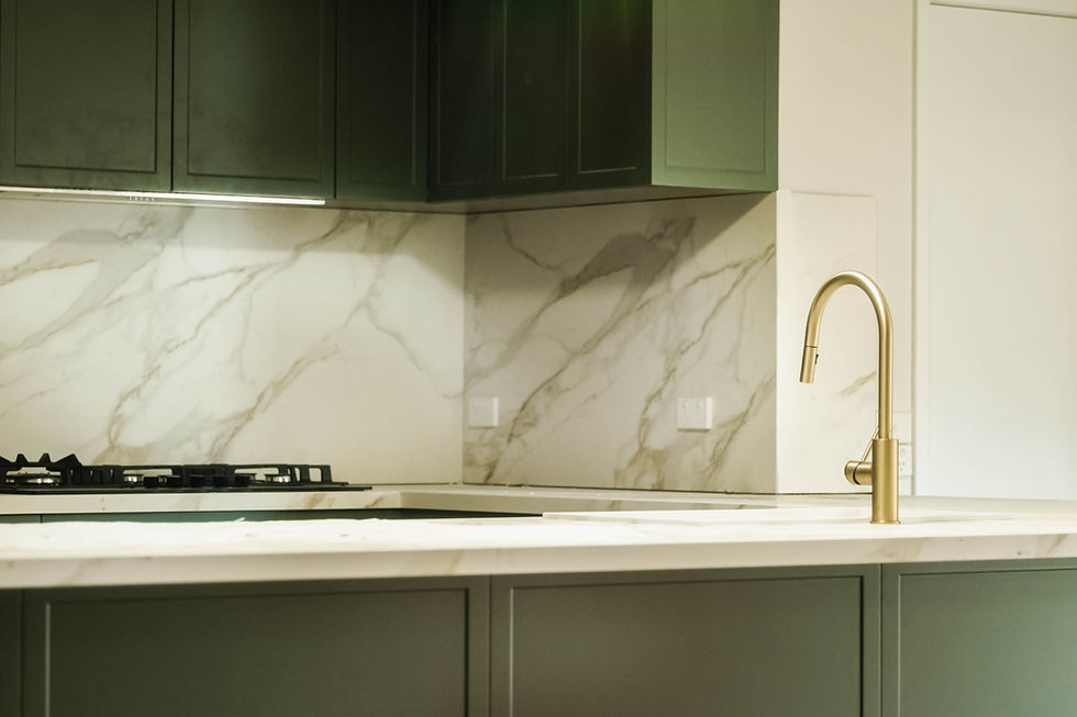 Contemporary kitchen interior with sleek white cabinets and island, perfect for a minimalist aesthetic.