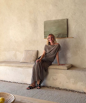 Rahel Kubach, founder of cielo.collective, sitting in a minimalist luxury hotel in Mallorca wearing a timeless slow living outfit. A creative entrepreneur and retreat host, embodying mindful living, conscious travel, and modern wellness aesthetics. Capturing the essence of luxury minimalism, creativity, and balance — representing cielo’s philosophy of slowing down and creating meaningful experiences through retreats, brand experiences, and mindful design.