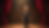 Eye-level view of a vintage ventriloquist dummy on a wooden stage