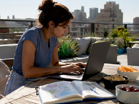 Woman browsing ticket promo codes on laptop