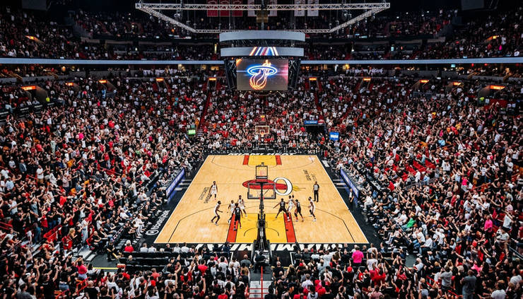 High-angle view of center-court upper bowl seats overlooking a basketball game