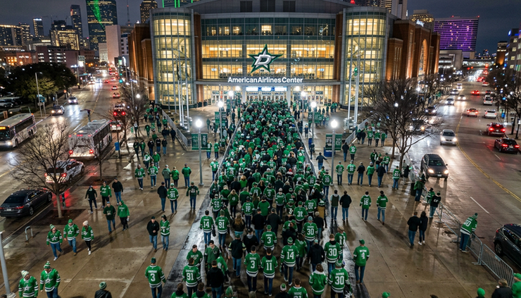 Overhead view of hockey fans walking toward American Airlines Center before a Dallas Stars game