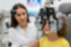 Boy and optometrist, accompanying article on eye health assessment for kids