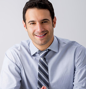 Man Sitting with a Tie