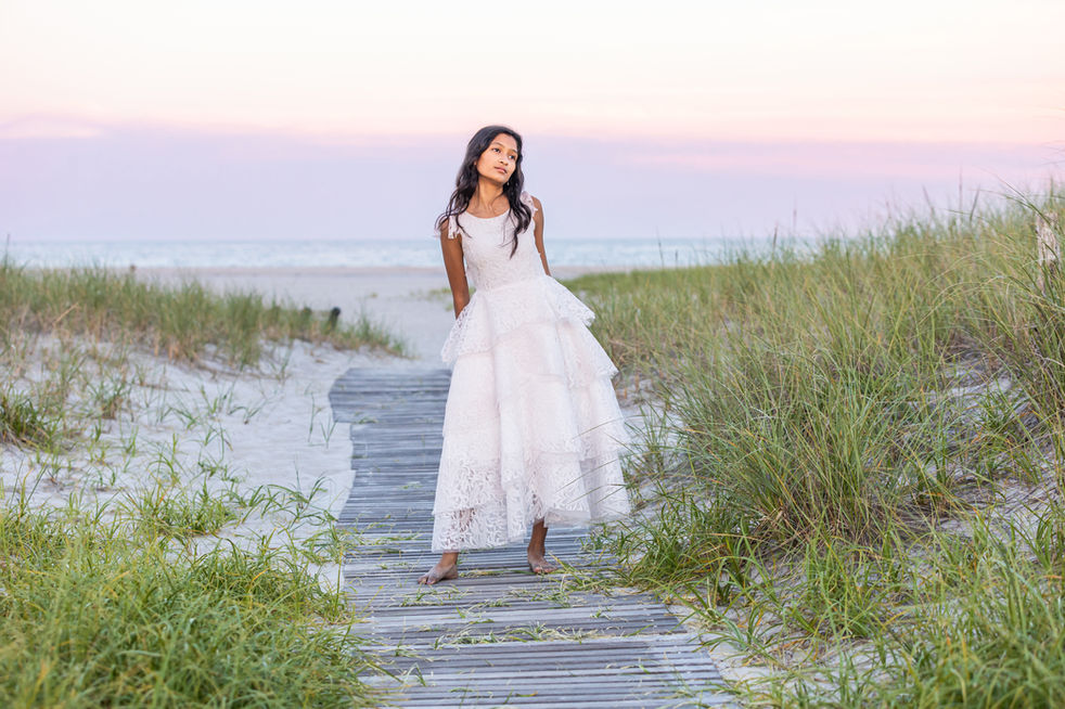Classic sunset beach portrait in LBI NJ featuring natural dunes and the Atlantic Ocean backdrop.