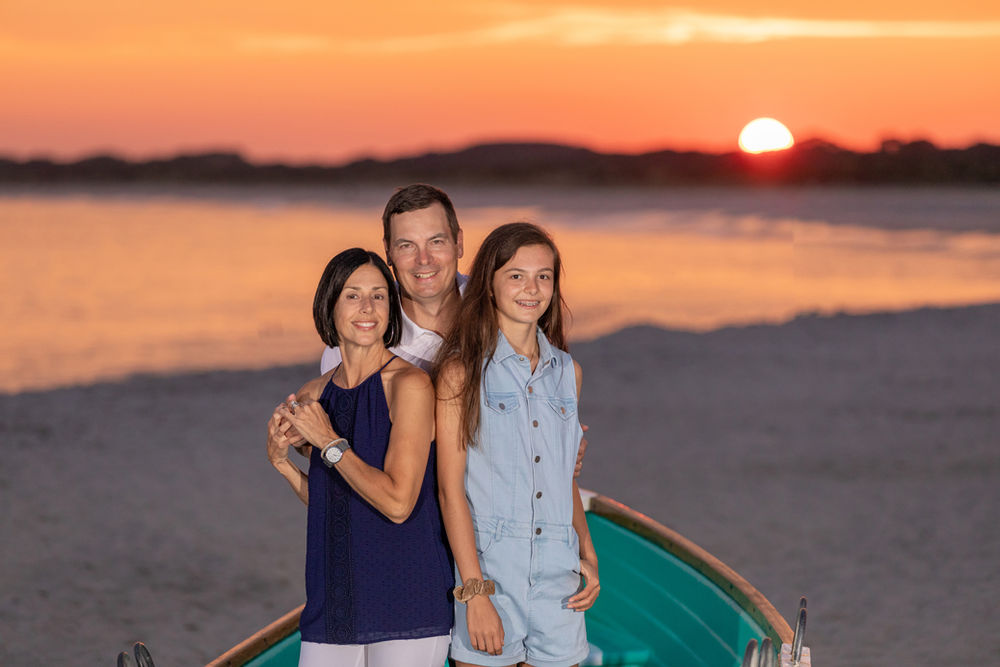Professional beach portraits in Cape May NJ featuring the lighthouse and coastal scenery.