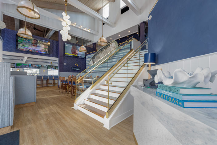 commercial photography of a grand staircase in a restaurant in stone harbor nj