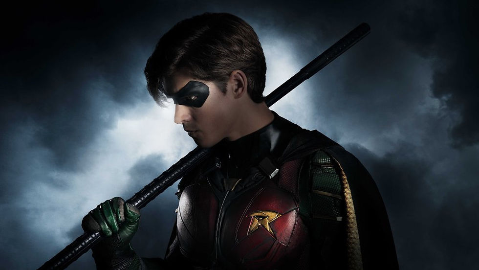Brenton Thwaites posing as his character, Robin.