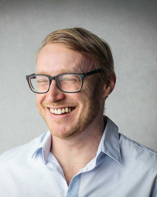 A man, laughing because of the joy he's experiencing