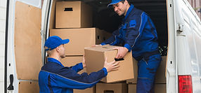 Photo of truck being loaded with boxes.