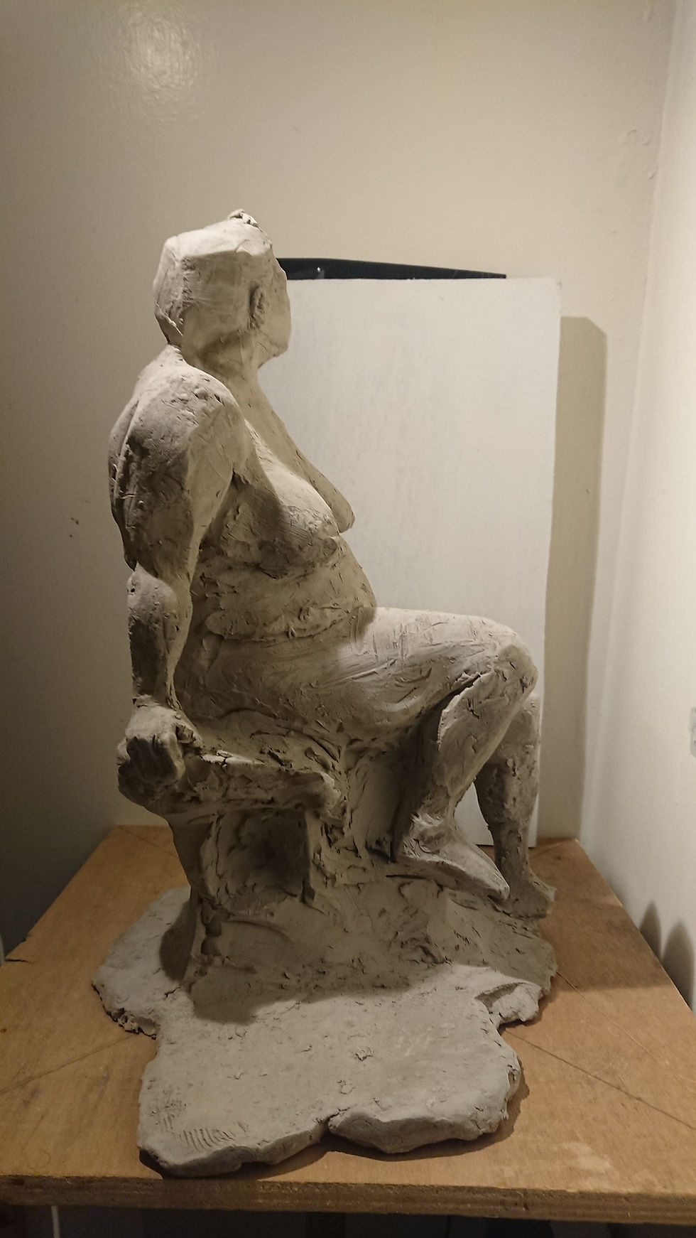 Female figure sculpted from clay
