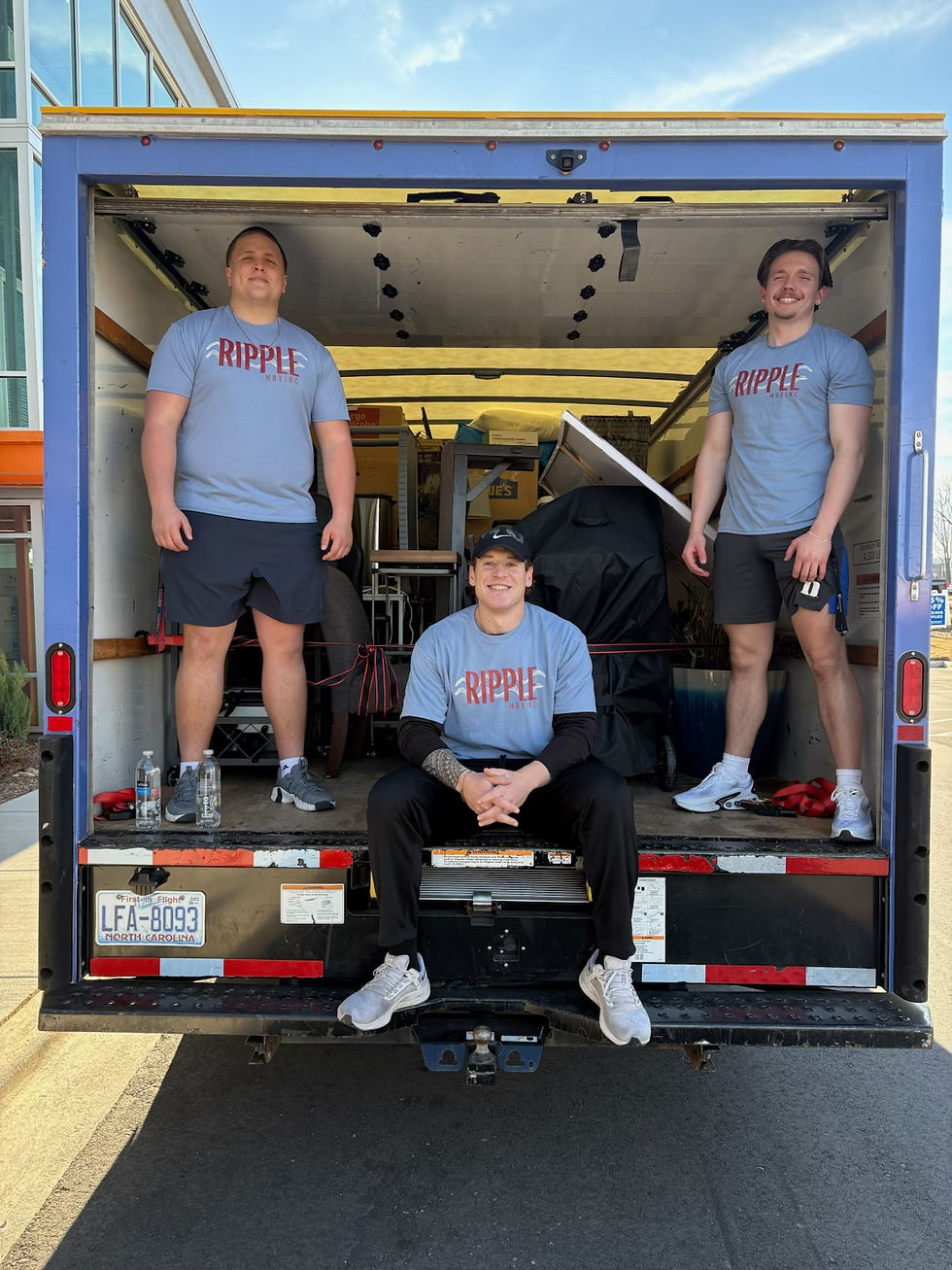 Eye-level view of a moving truck parked outside a Charlotte neighborhood home