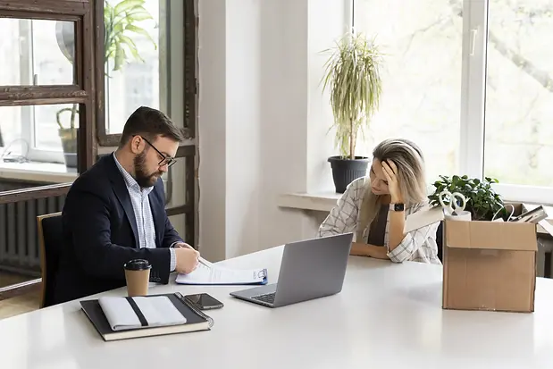 person-presenting-their-job-resignation.webp