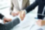 handshake-close-up-executives.webp