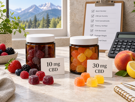 CBD gummy jars beside berries, peach and lemon for a product comparison