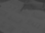 person holding pen near paper_edited.jpg
