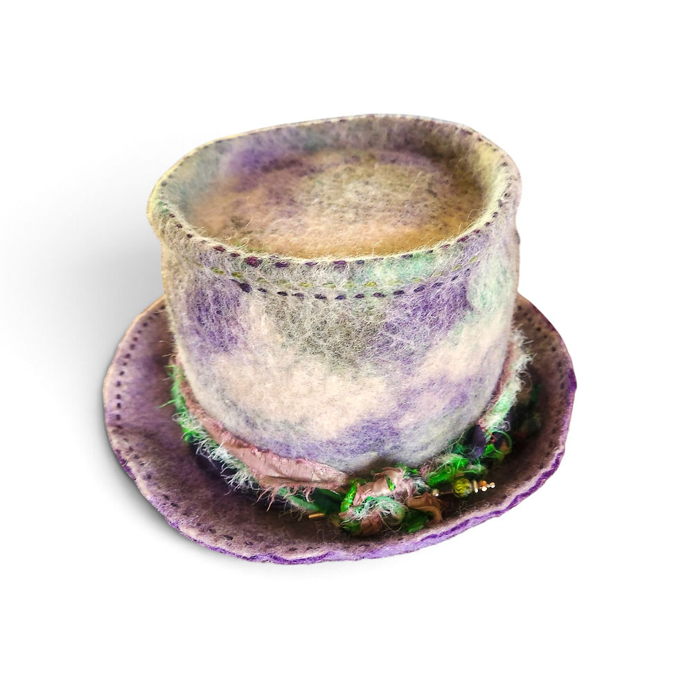A purple, pale fawn and green alpaca felt hat with a pink, green and purple hat band.